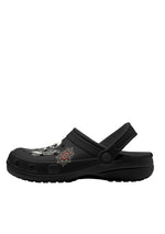 Side view of black gothic slippers with red flower burst and skull moth graphic