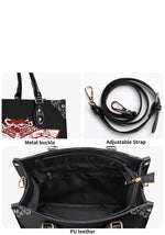 Detail view of metal buckle, adjustable strap, and PU leather lining of the gothic moth print bag