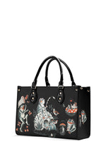 Side view of surreal frog-themed tattoo print handbag in vintage style