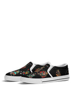 White-trimmed slip-on shoes with vintage cartoon frogs and rainbow anti-tattoo statement on top