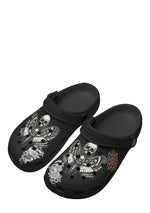 Angled view of death moth slippers with skull wings and floral prints