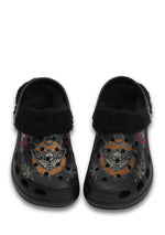 Front view of black fuzzy clogs with orange death moth and teardrop accents