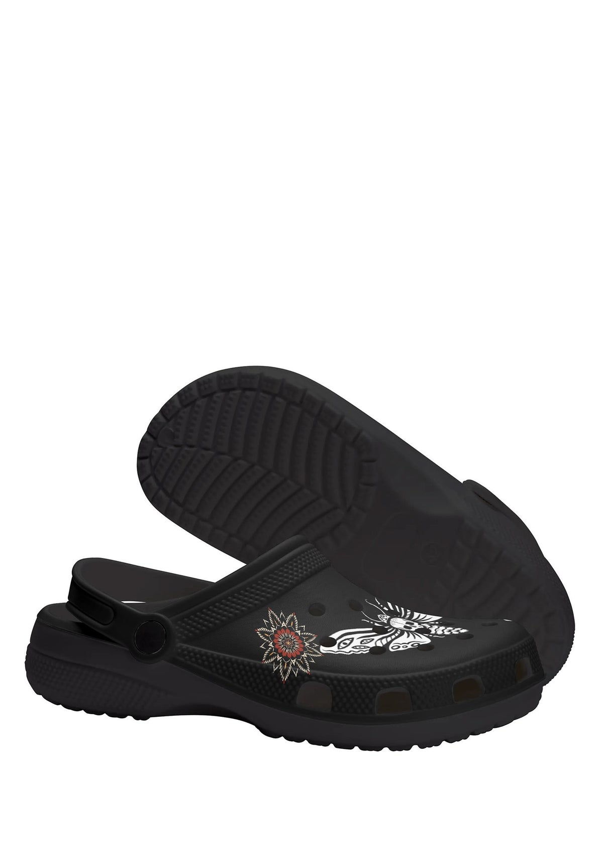 Sole view showing grip texture and floral tattoo detail on black gothic slip-ons