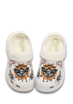 Front view of white fuzzy clog with gothic orange moth and floral graphics