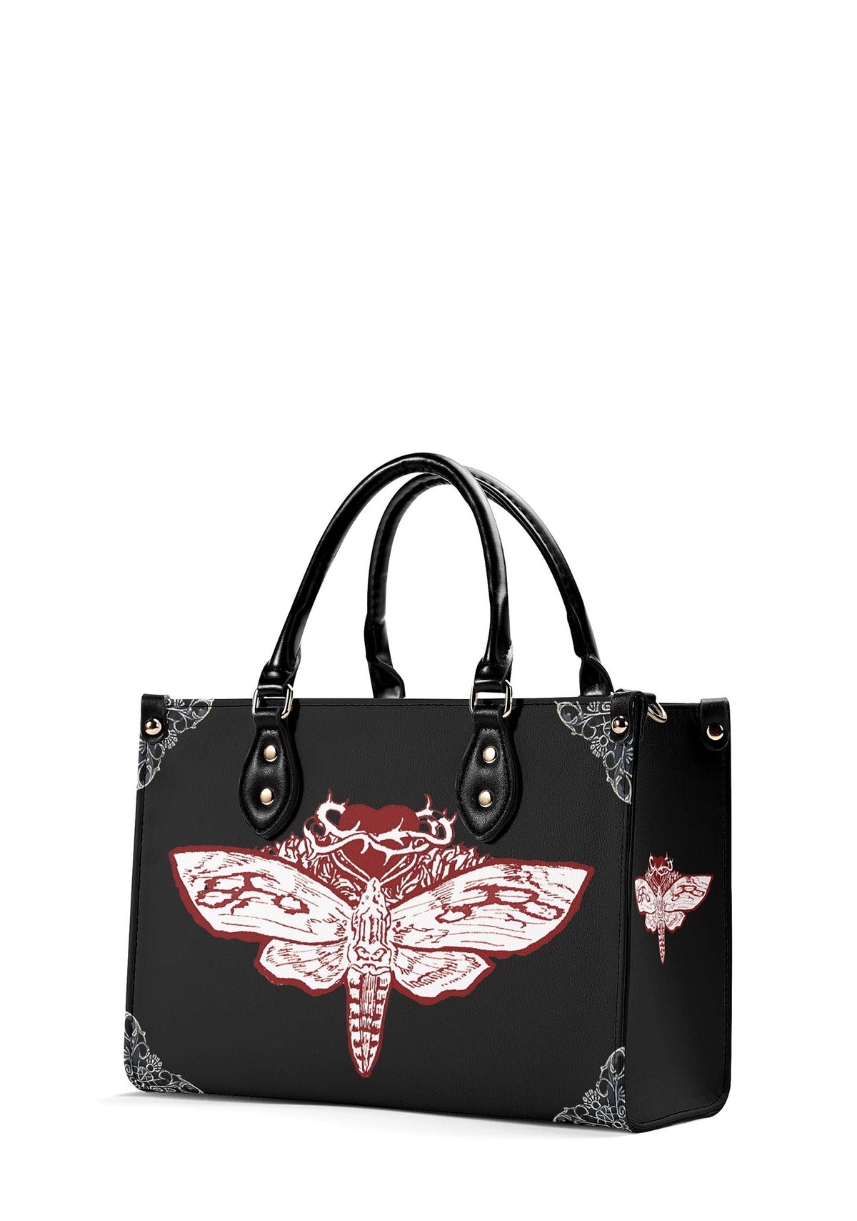 Three-quarter view of the handbag showing side moth detail and thorned heart artwork