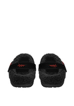 Rear view of cozy slippers with venom moth print and flame detail