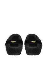 Back view of fuzzy slippers with ritual moth and cozy lining