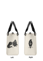 Animal print handbag showing raven, fox, and wolf illustrations