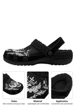 Close-up of the winged heart graphic, focusing on the white heart with spread wings, the small cross at its center, and the "I Am Still" lettering detail against the plush fabric