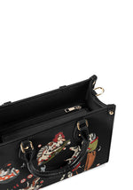 Inside compartment view of black gothic handbag with zipper pocket