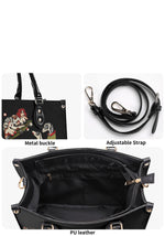 Close-up of gold hardware and detachable strap on tattoo-style bag