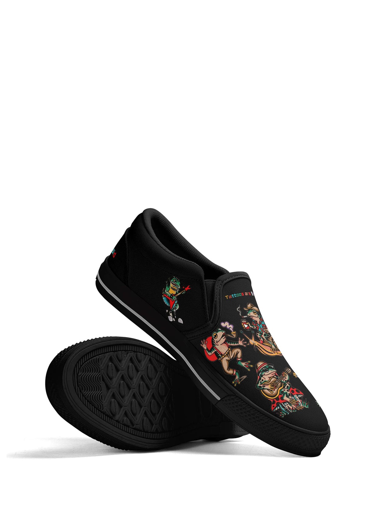 Stacked frog tattoo slip-ons in black showing off surreal cartoon graphics and white-striped sole