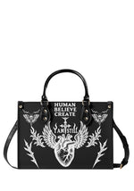 Black gothic handbag with anatomical heart and "I Am Still" quote