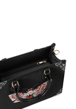 Inside view of black structured handbag with zipper and spacious interior