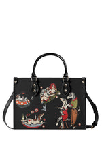 Black handbag with dancing dogs and pin-up girl tattoo art