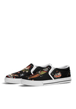 Pair of white-trim gothic slip-ons featuring dogs dancing and drinking