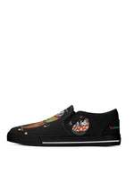 Left shoe showing dog couple in bathtub and bold tattoo print