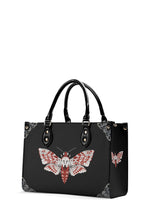 Side view of Venom Moth Handbag showing gothic moth print and bag structure